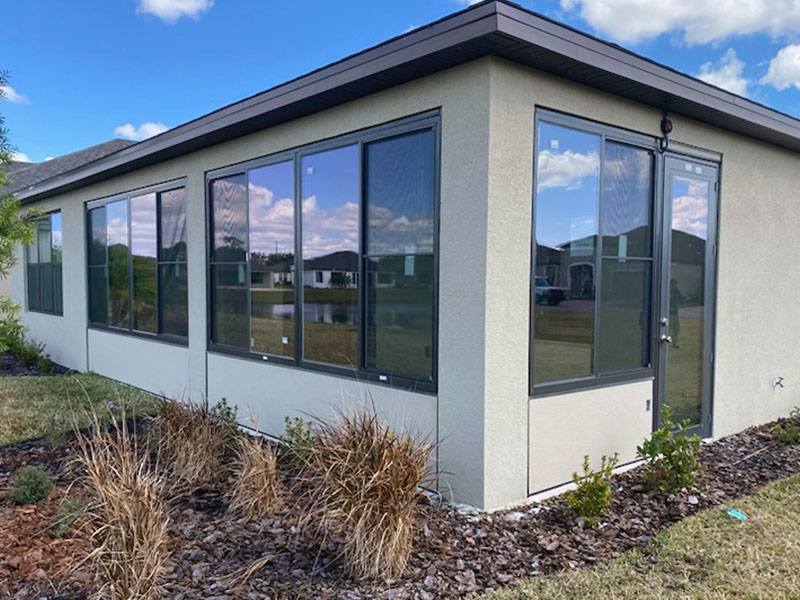 Wind breaker vinyl windows on Sunroom.