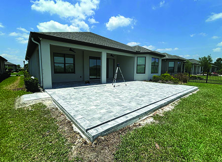 Pavers installed before enclosure installed.