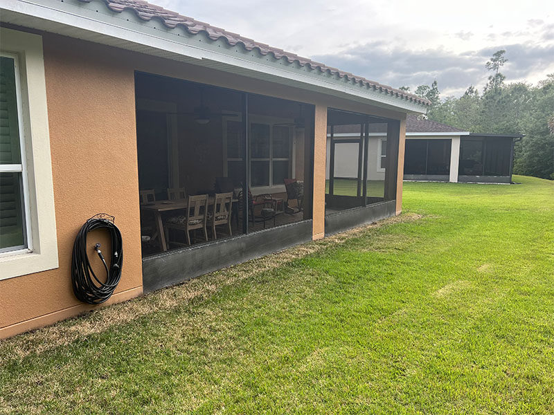Side view of rear lanai in Poinciana, Florida before transformation