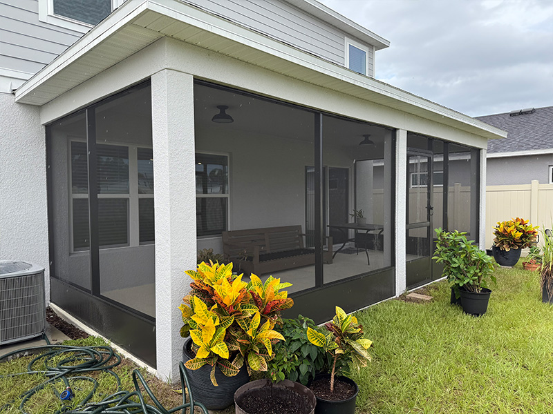 Screened in porch installation in Clermont, Florida. Existing covered lanai adding screen enclosure.