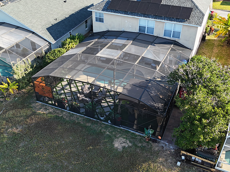 Aerial view of pool extension installed by MD Construction in Davenport Florida. Drone footage provided by Creative Fox Group of Auburndale FL Licensed Drone Pilots.