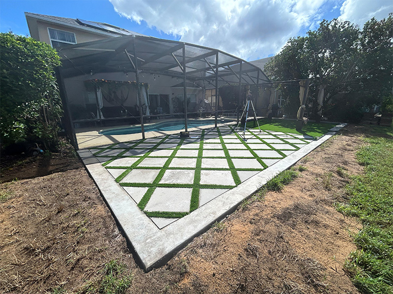 The footers installed with artificial turf installed before screen cage and screens are installed.