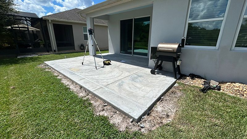 Concrete poured for screen room installation in St. Cloud.