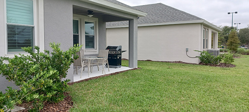 Photo taken by MD Construction sales person during the free consultation showing the existing back patio lanai to asses how big and how much the screen enclosure installation would cost in Lakeland, Polk County Florida.