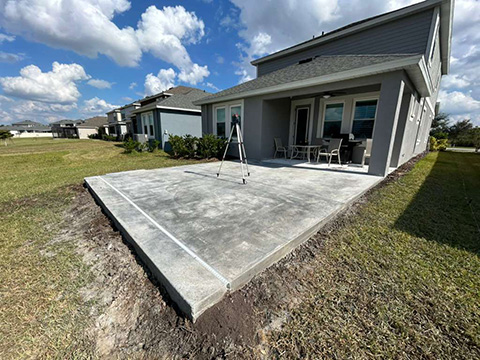 Photo taken by MD Construction workers of concrete extension for new screen enclosure in Lakeland, Polk County Florida.