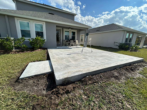 Photo taken by MD Construction workers of concrete extension for new screen enclosure in Lakeland, Polk County Florida.