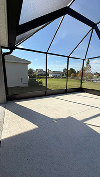 Photo taken by MD Construction workers of new screen enclosure installed off existing covered patio in Lakeland, Polk County Florida.