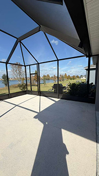 Photo taken by MD Construction workers of new screen enclosure installed off existing covered patio in Lakeland, Polk County Florida.