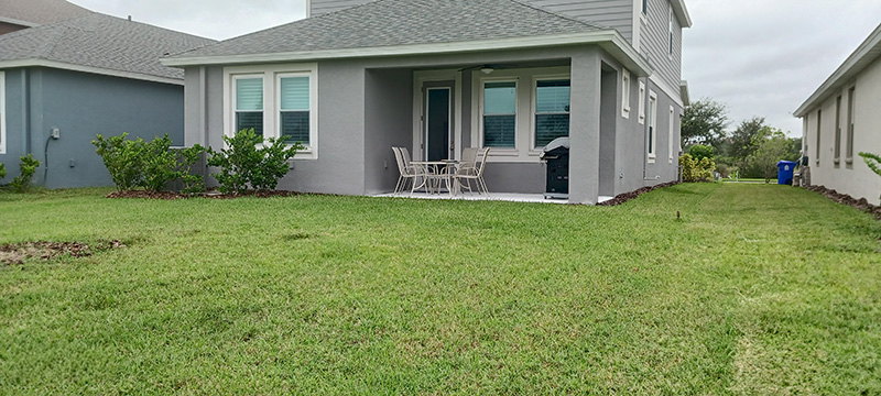 Back existing covered lanai before screen enclosure installed.