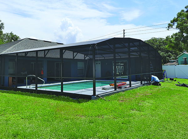 MD Construction worker installing screen on pool enclosure. Installed in Lakeland, Florida Installed by MD Construction. Garage screen enclosures. Front lanai installation review. Screen enclosures. Screening a lanai. Screen enclosures near me. Sunrooms Orlando Florida. Patio Lanai. Sunroom Orlando fl. Lanai Patio enclosure. Patio enclosure suppliers. Patio cover with screen. Pool enclosure Central Florida. patio cover screen. in Central Florida screened in porch. screen patio covers. pool screen enclosures Central Florida. screen pool enclosures Central Florida. patio screen enclosures near me. Florida porches