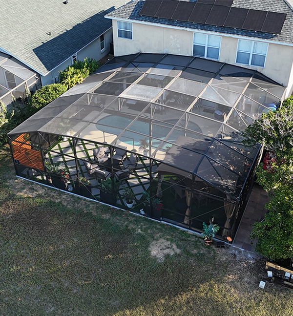Aerial shot of pool screen enclosure installation in Davenport, Florida for customer review.