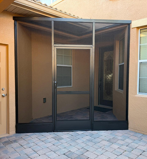 Screened front entry way installation in Kissimmee, FL by MD Construction, LLC.