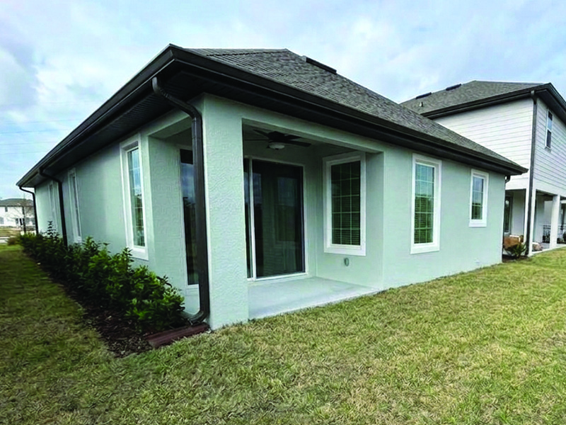 Before photo of a recent screen enclosure job in Kissimmee, Florida. The customer wanted to expanded their back patio with new concrete and a screen enclosure.