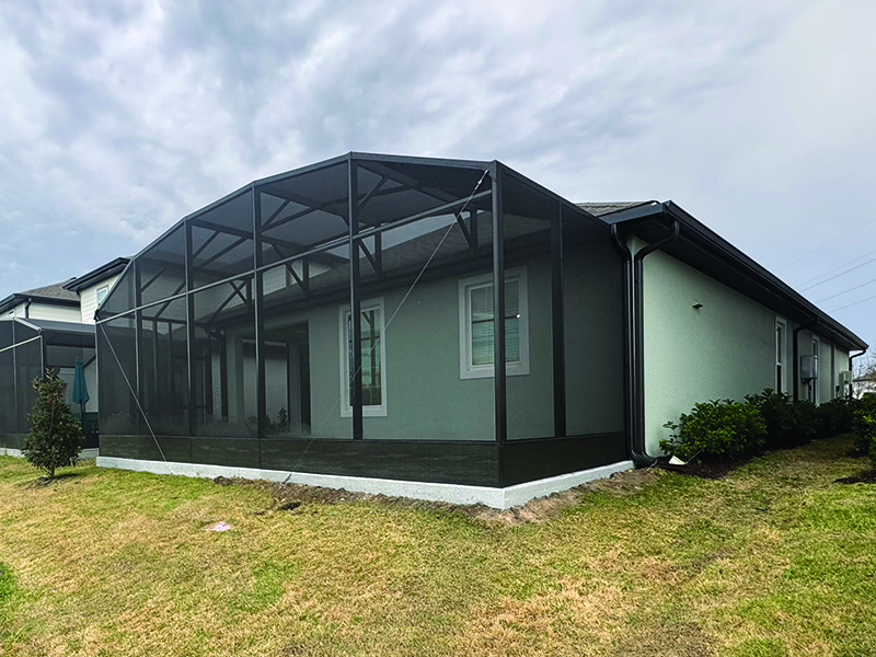 After photo of opposite side of a recent patio expansion into screen enclosure job in Kissimmee, Florida.