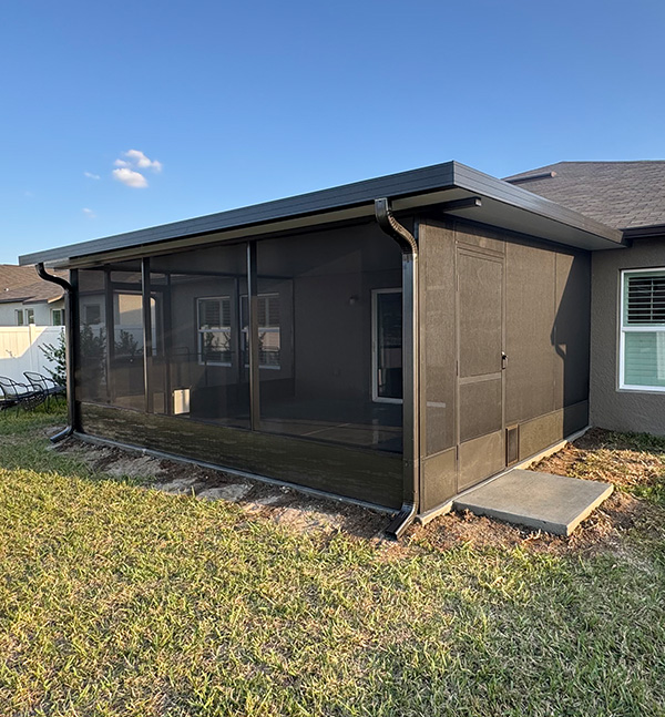 Back patio extension in Bartow Florida with a screen room by MD Construction.