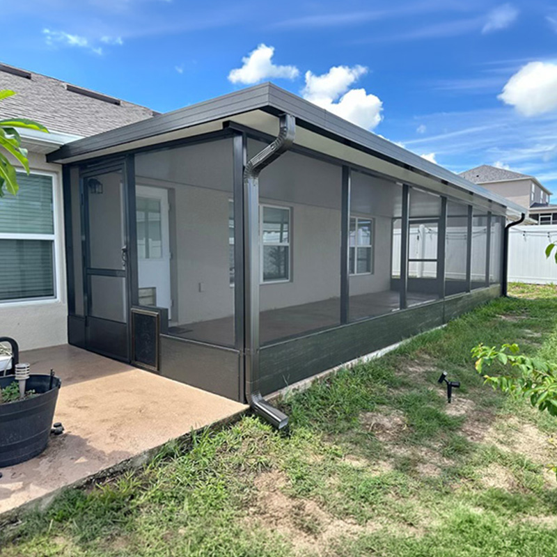 Back patio extension with a screen room in Poinciana by MD Construction.