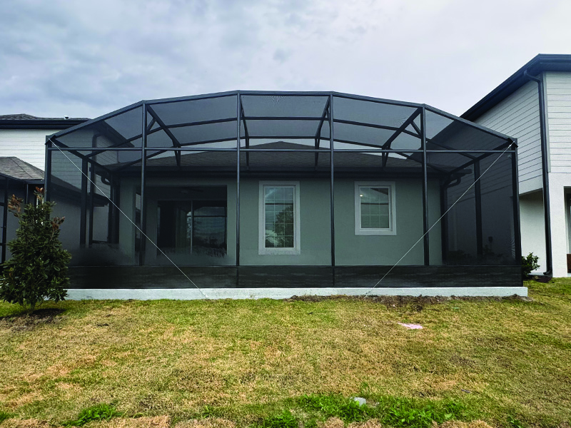 After photo of straight on view of a recent patio expansion into screen enclosure job in Kissimmee, Florida.