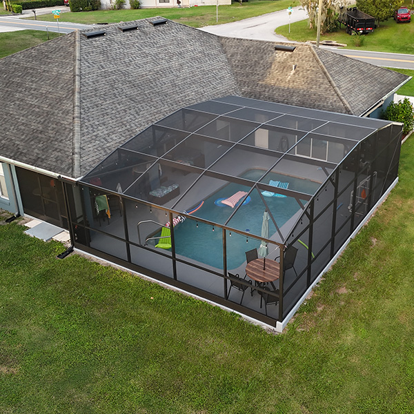 Aerial shot of pool enclosure extension that MD Construction installed in Lakeland, Florida.