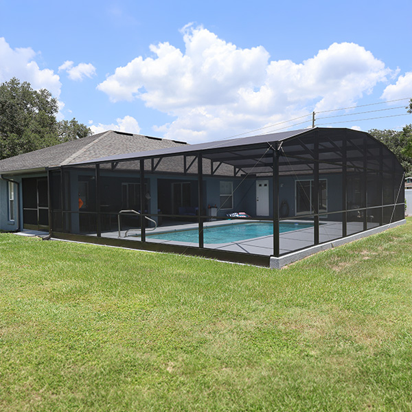 Outside view of pool enclosure extension that MD Construction installed in Lakeland, Florida.