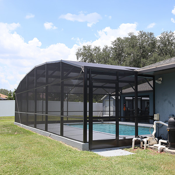 Outside view of pool enclosure extension that MD Construction installed in Lakeland, Florida.