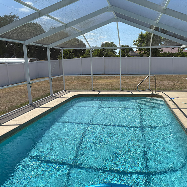 Inside view of existing pool enclosure showing space between the pool and the enclosure.