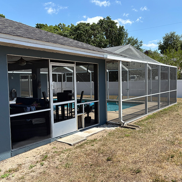 Outside view of the existing screen enclosure and screened patio area in Lakeland, Florida.