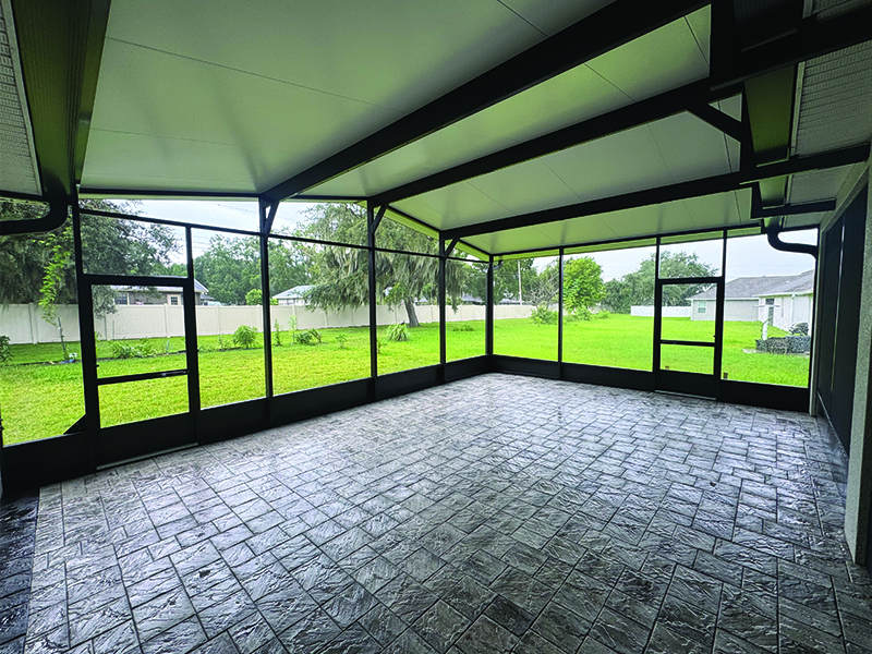 inside-view-of-screen-room-expansion-in-lakeland-florida Inside view of screen room installation looking out.