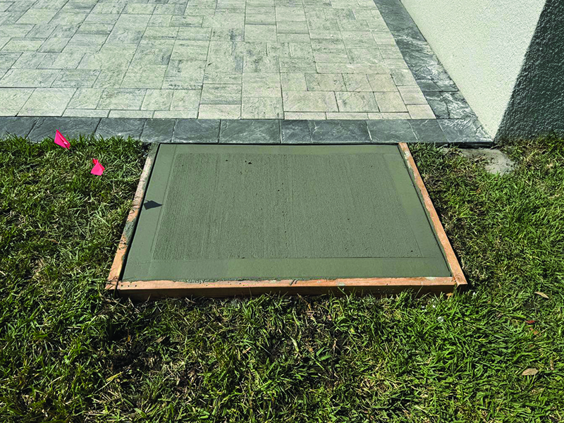 new-concrete-installed-in-lakeland-by-md-construction Other new concrete door pad installed by MD Construction outside the pavers for the screen room.