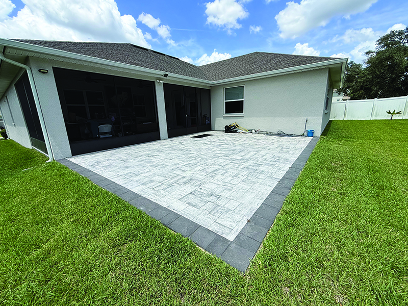 side-view-of-pavers-before-screen-room-was-installed Before photo of the uncovered pavers and screened lanai before screen room installation.