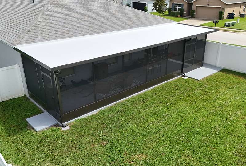 Side view of screen room installation by MD Construction in Auburndale, Florida.